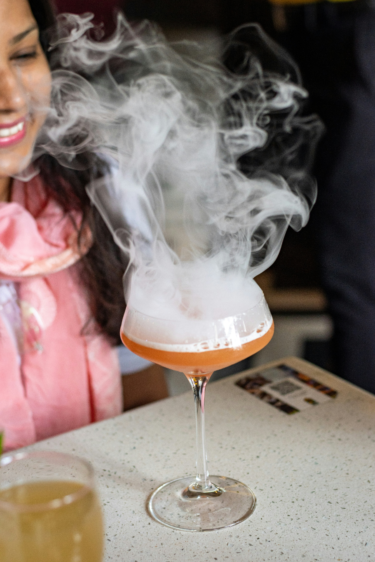 A smoking signature cocktail at La Luna