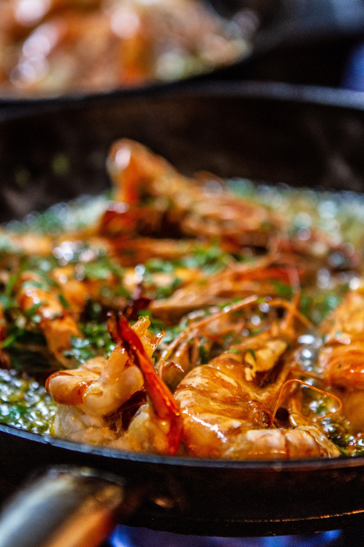 Garlic king prawns sizzling in the pan