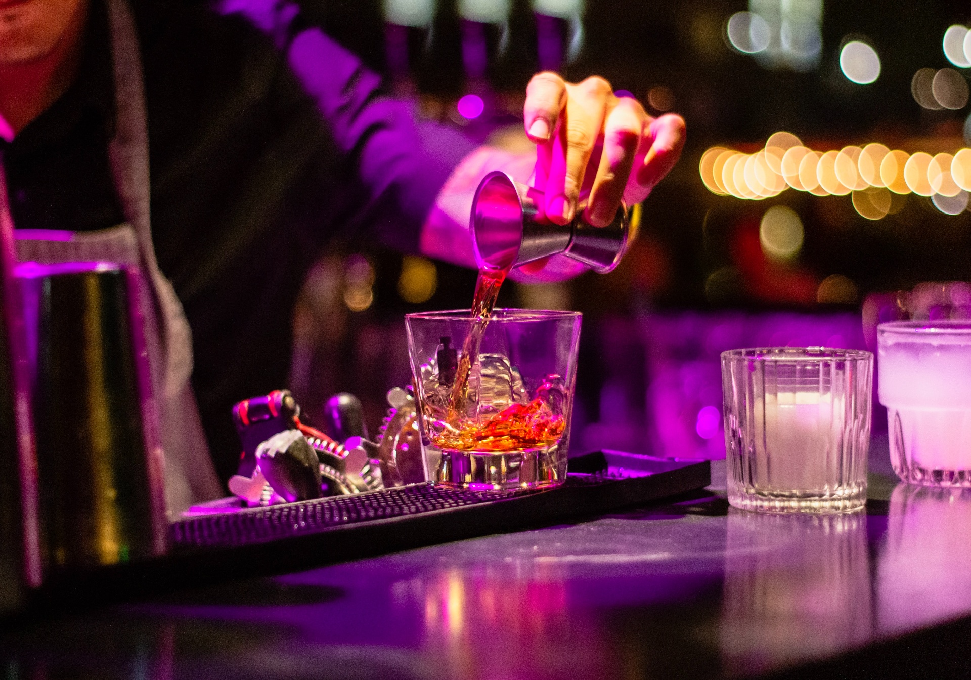 Bartender pouring a cocktail at La Luna